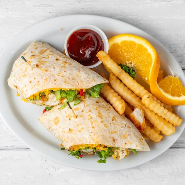 Chicken wrap with lettuce, cheese, and red peppers, served with fries, orange slices, and ketchup.
